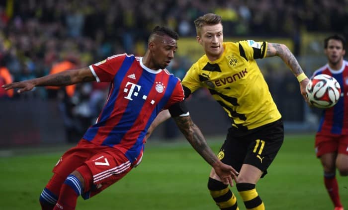 Bayern Jerome Boateng und Dortmund's Marco Reus (R) beim Bundesliga Spiel Borussia Dortmund gegen den FC Bayern München in Dortmund am 4.April 2015. AFP PHOTO / PATRIK STOLLARZ