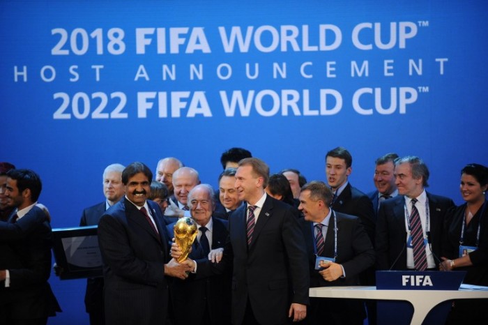 Emir of the State of Qatar Sheikh Hamad bin Khalifa Al-Thani (L), Fifa President Joseph Blatter (C) and Russia's Deputy Prime Minister Igor Shuvalov pose with the World Cup following the announcement that Russia and Qatar will host the 2018 and 2022 World Cups on December 2, 2010 at the FIFA headquarters in Zurich. AFP PHOTO / PHILIPPE DESMAZES