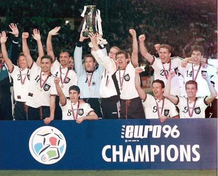 German goalkeeper Andreas Kopke, holding the cup, jubilates with his teammates after forward Oliver Bierhoff (20) scored the first-ever golden goal in extra time in international competition against the Czech Republic during the Euro96 soccer championship final, to give Germany a  2-1 victory at London's Wembley stadium, 30 June 1996.         (ELECTRONIC IMAGE)