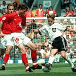 Thomas Haessler of Germany(R) tries to dribble past Russians Dmitri Khokhlov(L) and Vladislav Radimov (C) during the group C match Russia vs Germany at the European soccer Championships in Manchester 16 June. AFP PHOTO