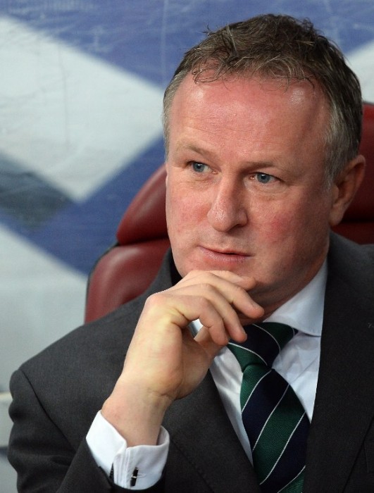 Northern Ireland's national team's head coach Michael O'Neill is pictured prior to the UEFA 2016 European Championship qualifying round Group F football match Romania vs Northern Ireland at the Arena Nationala stadium in Bucharest on November 14, 2014. Romania won the match 2-0. AFP PHOTO / DANIEL MIHAILESCU